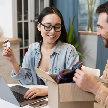 Team defining project requirements around a laptop